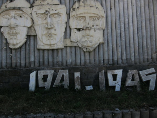 Monument with bullet holes.